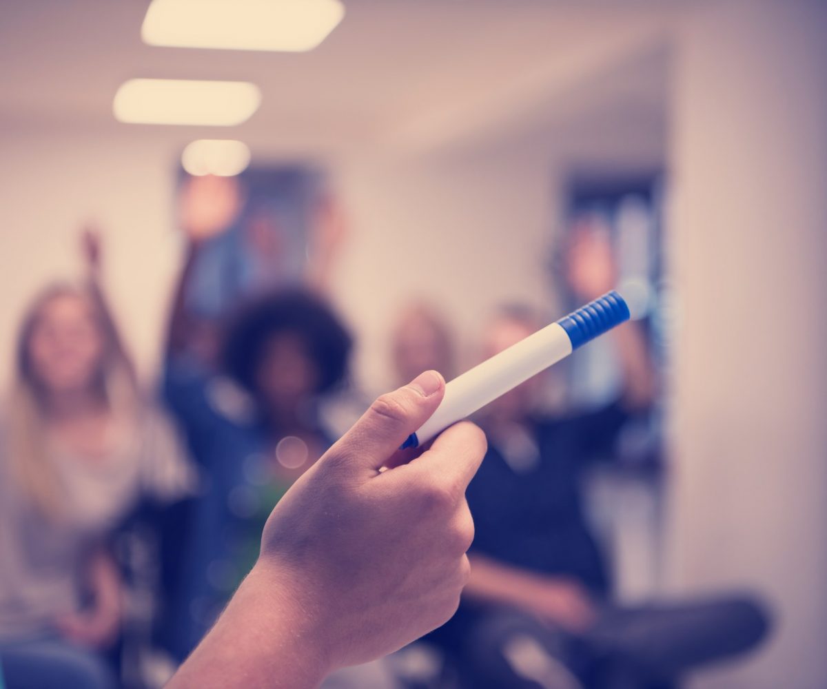 close up of teacher hand with marker