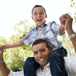 Hispanic Father and Son Having Fun Together in the Park.