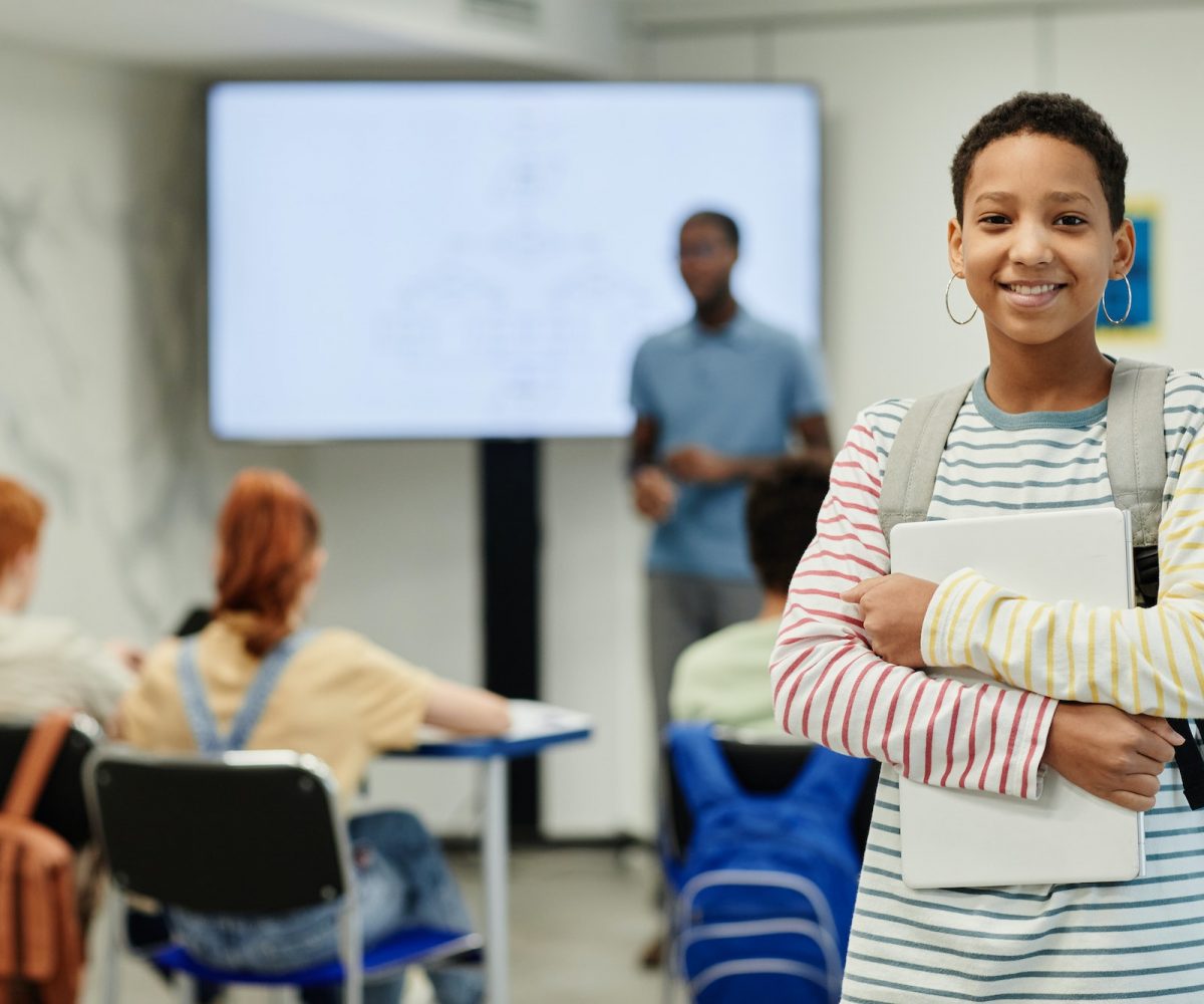 Smiling Teenage Girl in School